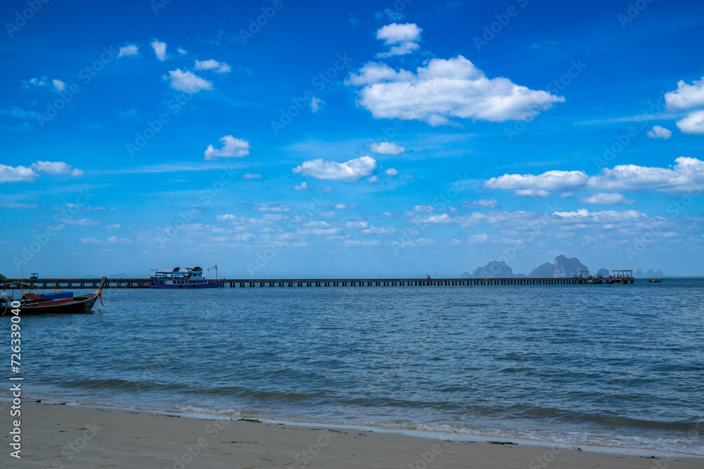 View of tropical island with white sand and turquoise crystal clear sea water.	