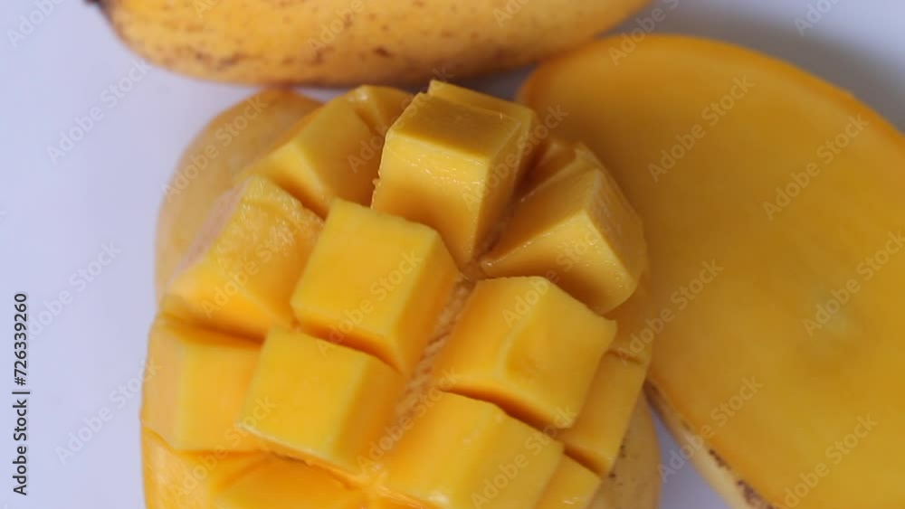 Rotation of ripped mango slice cubes cut, Mango half cut in cubes, Fresh juicy mango fruit Rotation of ripped mango slice cubes cut, Mango half cut in cubes, Fresh juicy mango fruit