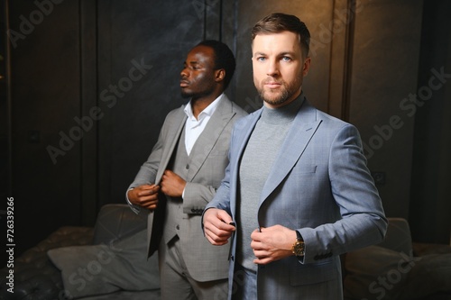 Obraz na plátně Portrait of two handsome young men in elegant classic suits
