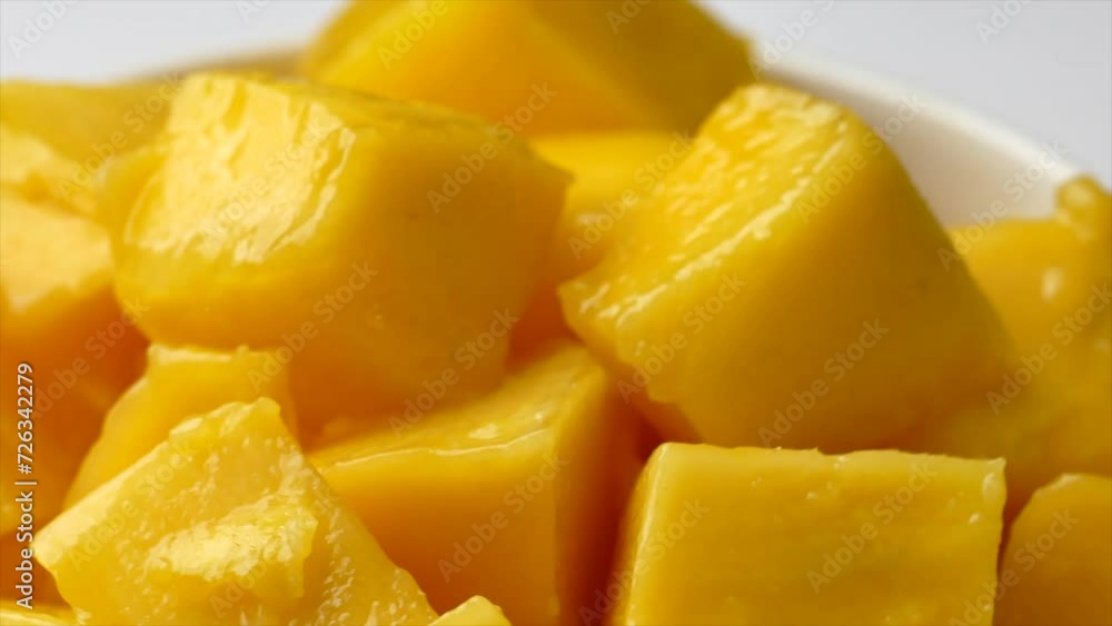 Rotation of ripped mango slice cubes cut, Mango half cut in cubes, Fresh juicy mango fruit Rotation of ripped mango slice cubes cut, Mango half cut in cubes, Fresh juicy mango fruit