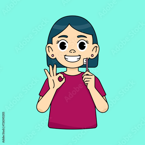 The girl holds a toothbrush, the other hand shows the OK sign with her fingers. Oral cleanliness and hygiene concept