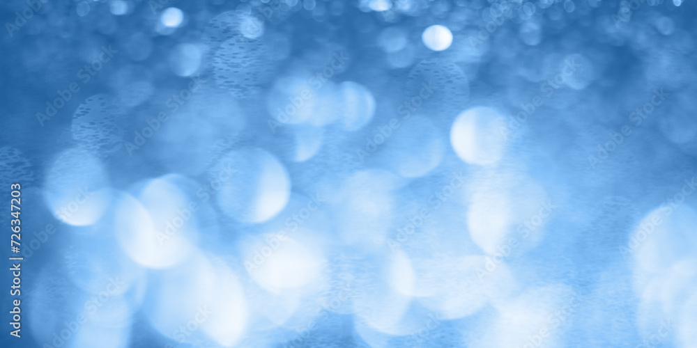 Abstract blue bokeh background. Beautiful background with blurry lights. Banner
