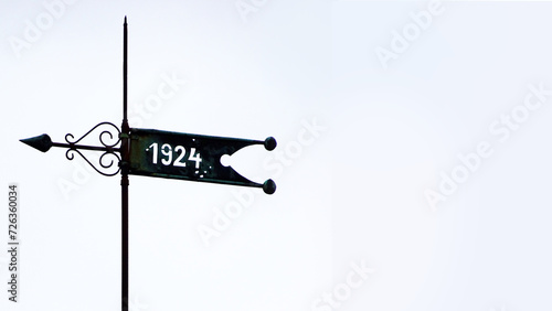 Φωτογραφία Custom made weathervane in Germany with a year on a banner