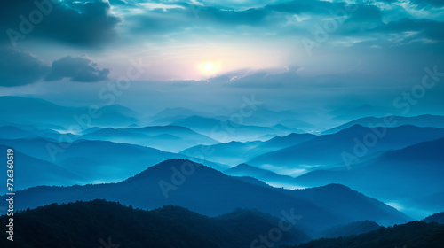 A View of a Mountain Range With the Sun in the Distance