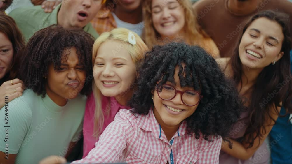 Multiethnic group of teenagers hanging out in the city center. Concepts about campus university students, friendship, and generation z Multiethnic group of teenagers hanging out in the city center. Concepts about campus university students, friendship, and generation z