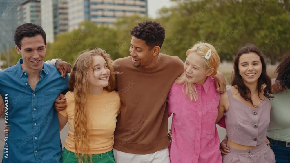 Multiethnic group of teenagers hanging out in the city center. Concepts about campus university students, friendship, and generation z Multiethnic group of teenagers hanging out in the city center. Concepts about campus university students, friendship, and generation z