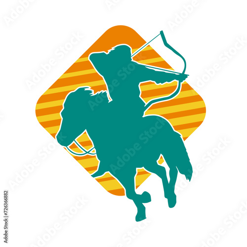 Silhouette of an ancient cavalry soldier aiming with archery weapon. Silhouette of an archer on his running horse.
