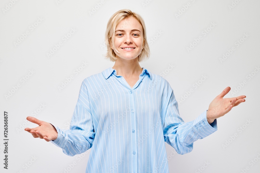Portrait blond young woman happy face smiling joyfully with raised palms and shocked open mouth isolated on white studio background. Portrait blond young woman happy face smiling joyfully with raised palms and shocked open mouth isolated on white studio background.