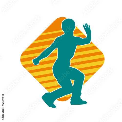 Silhouette of a man in oriental martial art pose. Silhouette of a male in martial art move.