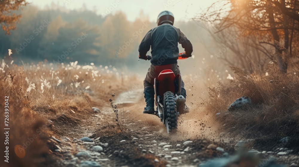 Fototapeta premium Motocross. Man, professional motorcyclist in full moto equipment riding crops enduro bike on mountain road at sunset. Generative AI. Concept of motosport, speed, hobby, journey, activity. In action