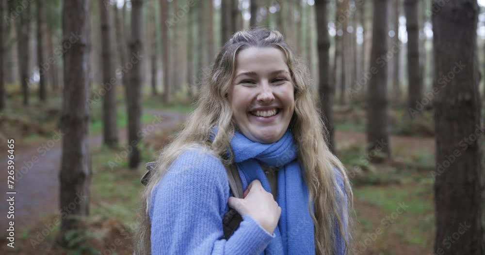 Smiling blond woman standing in forest Smiling blond woman standing in forest