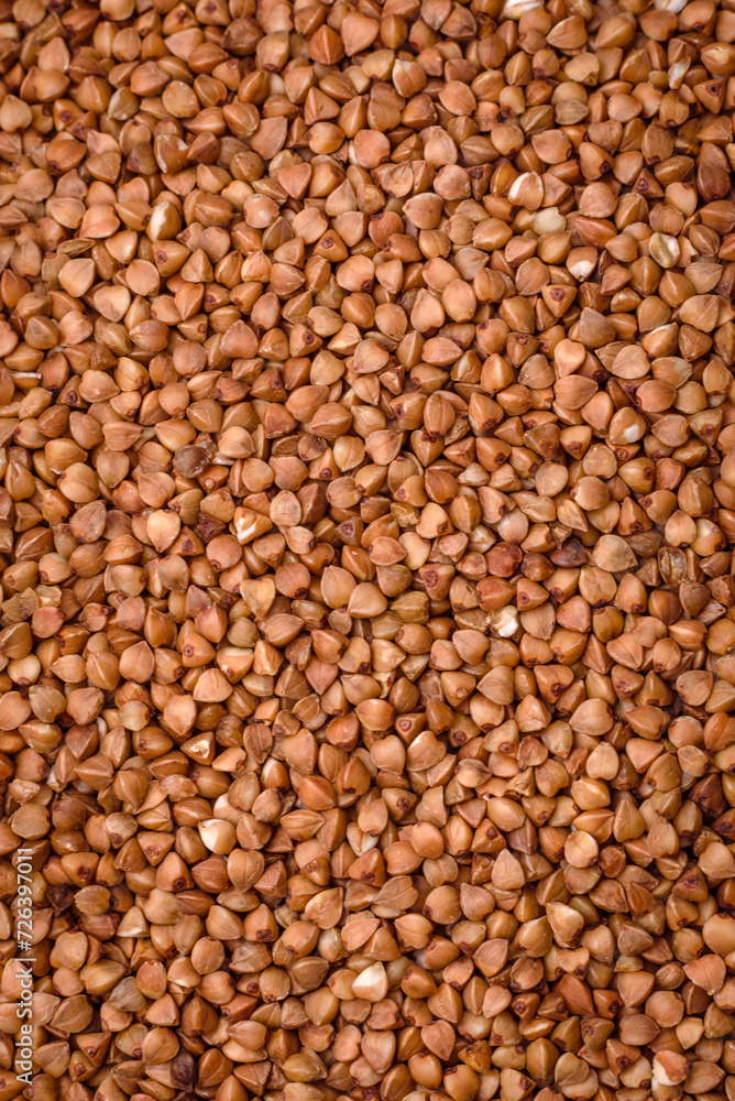 Large grains of raw buckwheat porridge are brown in color Large grains of raw buckwheat porridge are brown in color