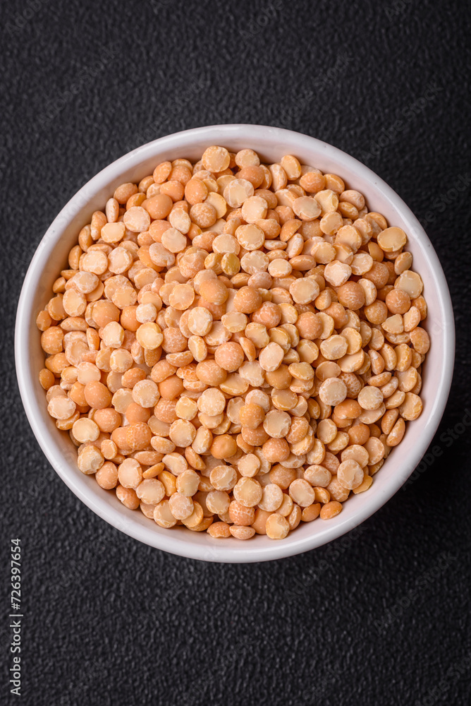 Dried pea grains, divided into halves, are yellow in color when raw Dried pea grains, divided into halves, are yellow in color when raw