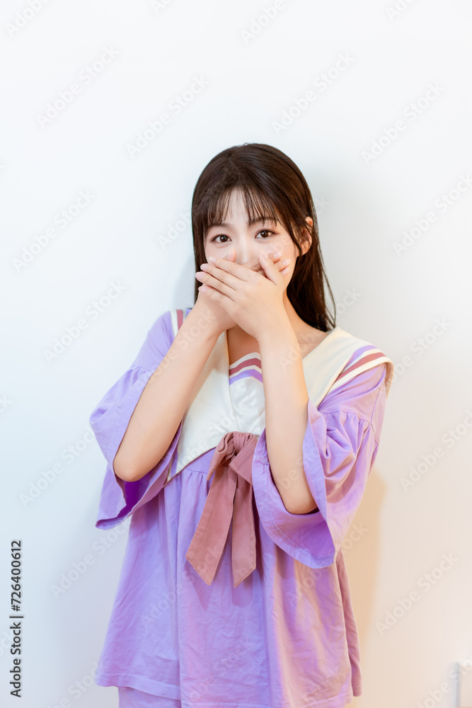 A young girl in a purple housedress A young girl in a purple housedress