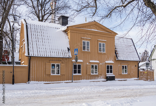 Photography Large characteristic old wooden yellow house on a tourist island near the amusem