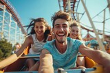 Happy friends having fun on roller coaster in an amusement park