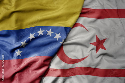 big waving national colorful flag of northern cyprus and national flag of venezuela . macro