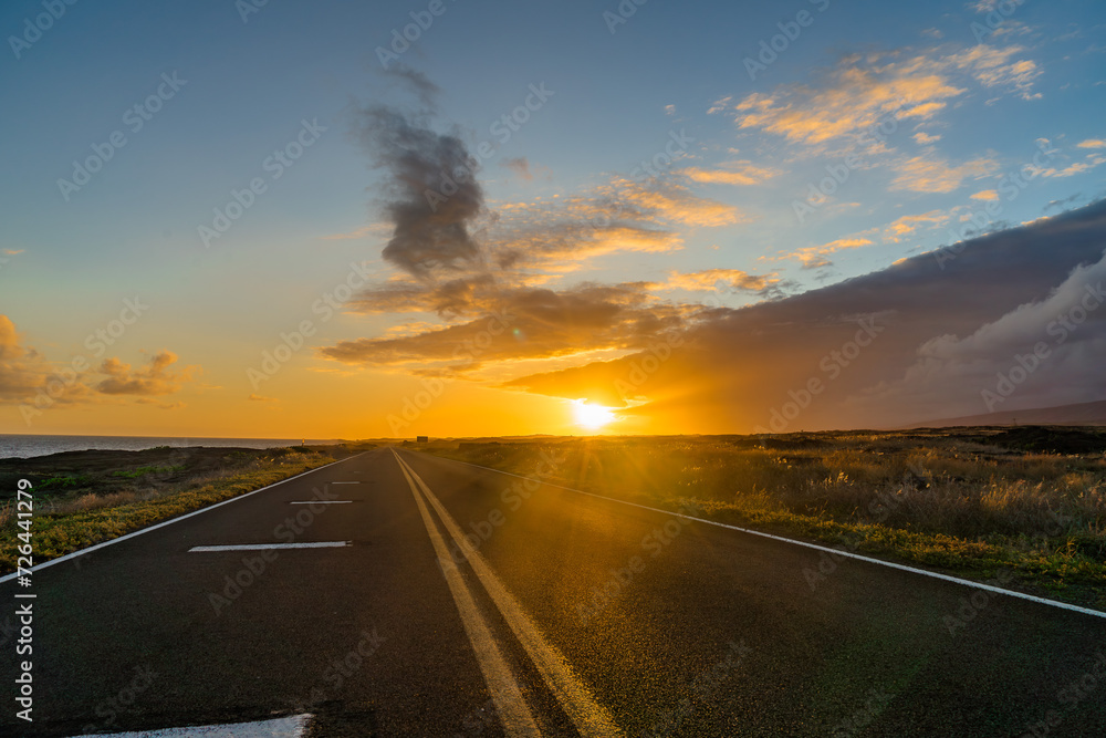 sunset on the road on the coast of the pacific on big island in hawaii