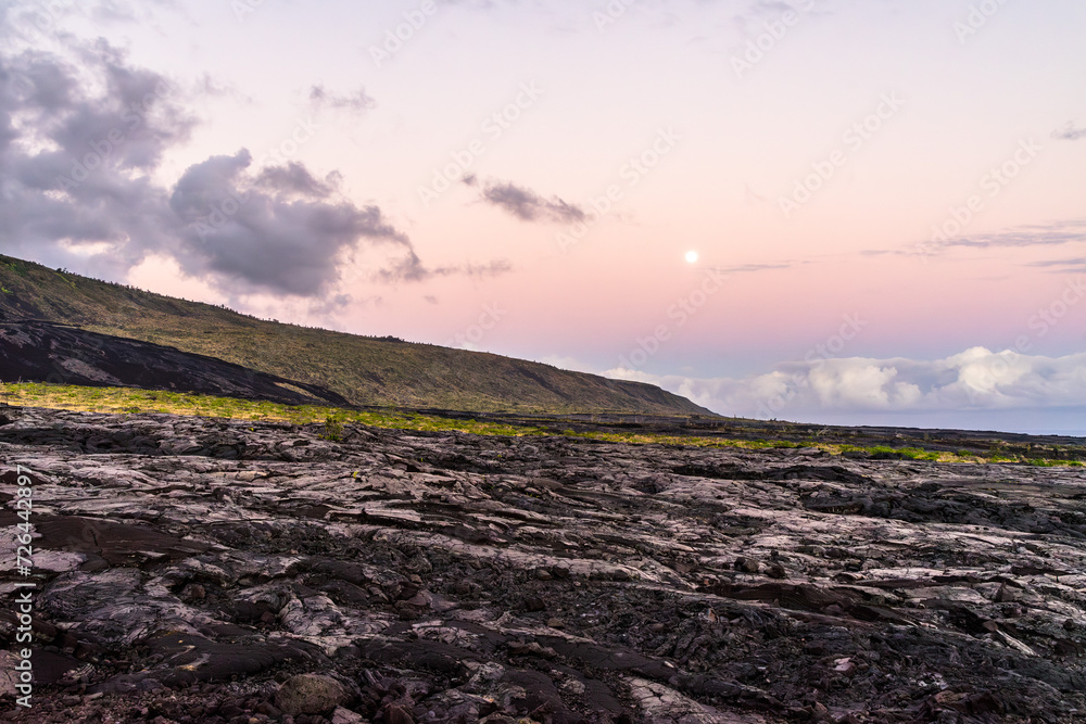 full moon over the volcanos on big island in hawaii