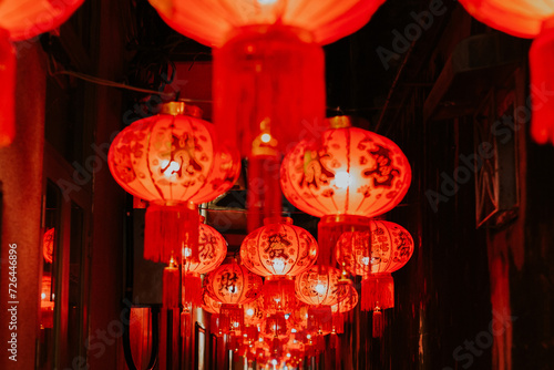 Traditional red lanterns hanging in the small alley.