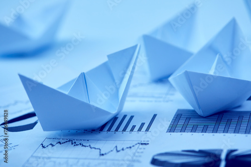 paper boats on the documents