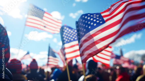 Rally in the square with American flags against the sky  blurred background  many people in square  blue clear sky with clouds  the importance and responsibility of participating in state elections