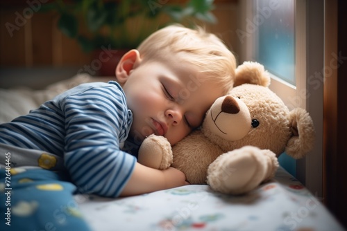 child hugging teddy bear while sleeping