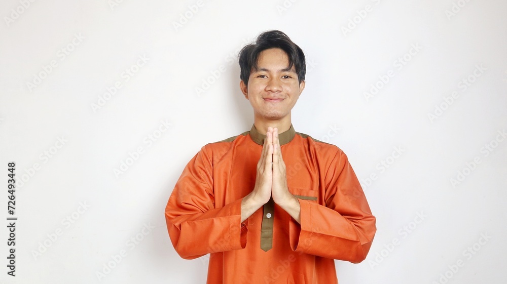 Asian Muslim man with greeting gesture Asian Muslim man with greeting gesture