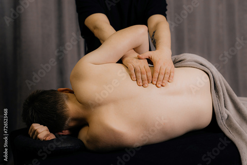 Modern rehabilitation physiotherapy worker with client