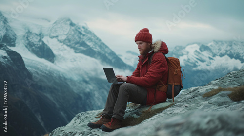 Work from travel, A man in Climbing clothing working from mountain