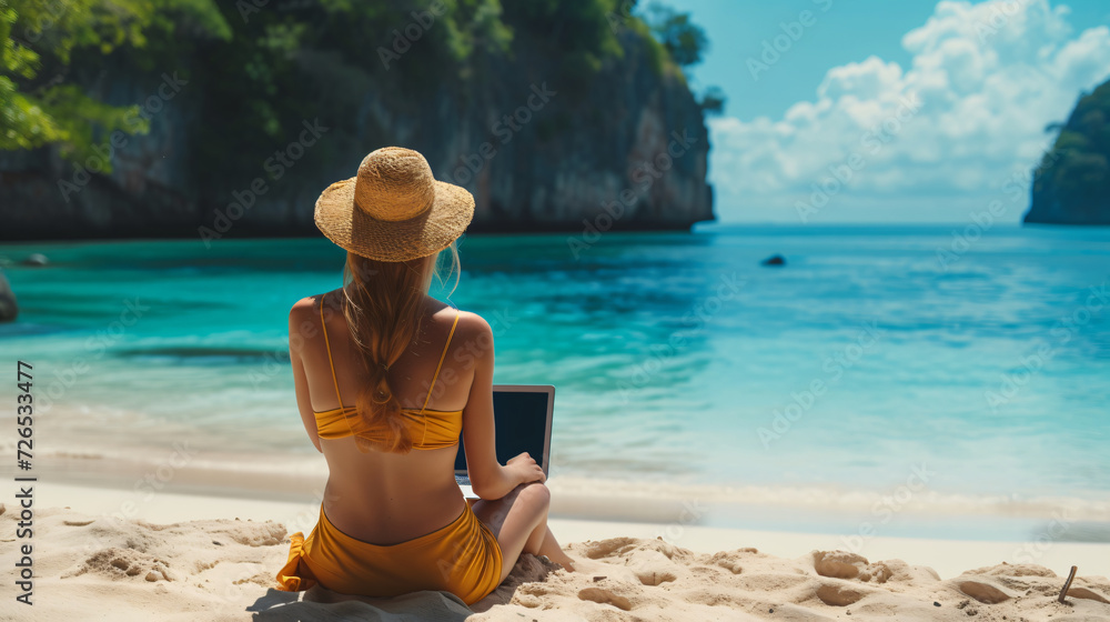 Work from travel, A Woman in swimming costume sitting and working on the beach