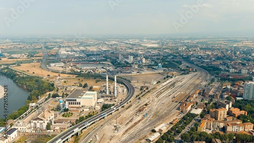 Piacenza, Italy. Industrial area with highway and railway station. Po River. Summer day, Aerial View