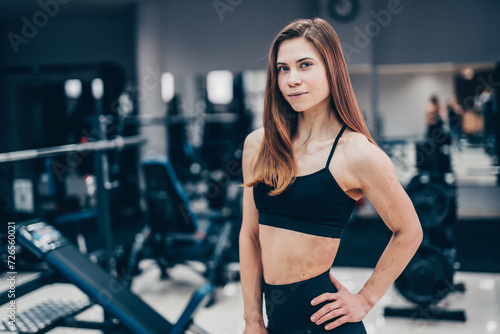 Young beautiful girl is engaged in gym