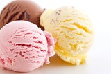 Three scoops of ice cream in strawberry, vanilla, and chocolate flavors, isolated on a white background.
