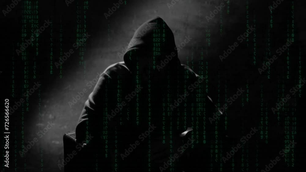 Anonymous man in a hood interview video footage, mysterious man sitting