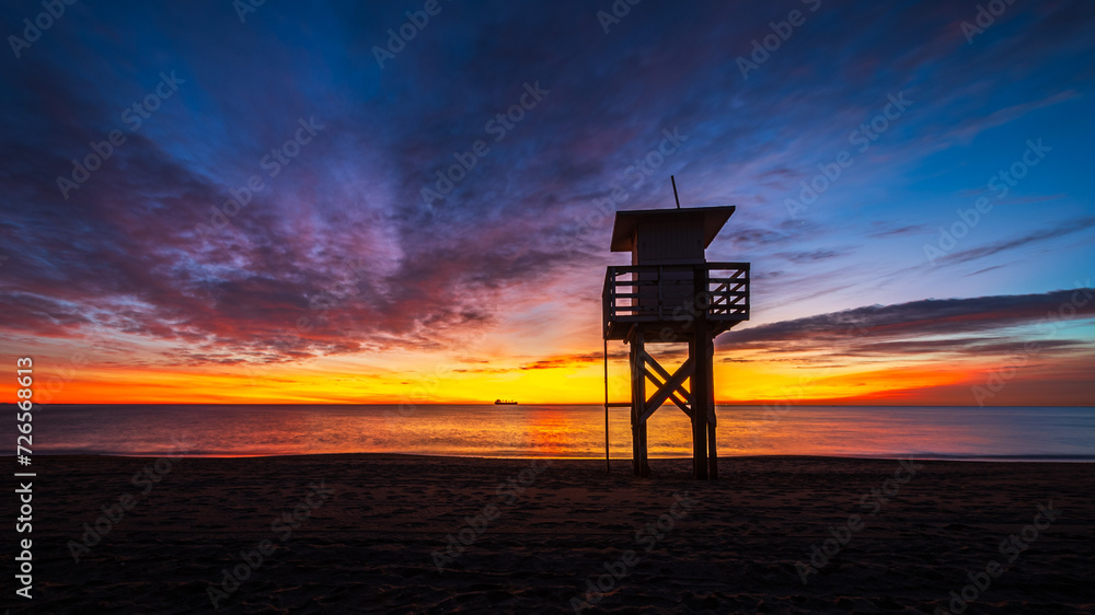 the lifeguard tower on the beach at sunrise  in Vera Playa
