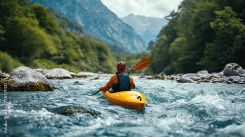 kayaker with whitewater kayaking, down a white water rapid river in the mountain
