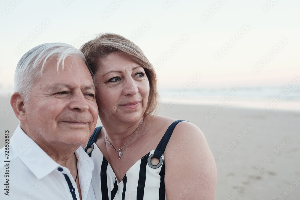 Happy multicultural senior couple on the beach Happy multicultural senior couple on the beach