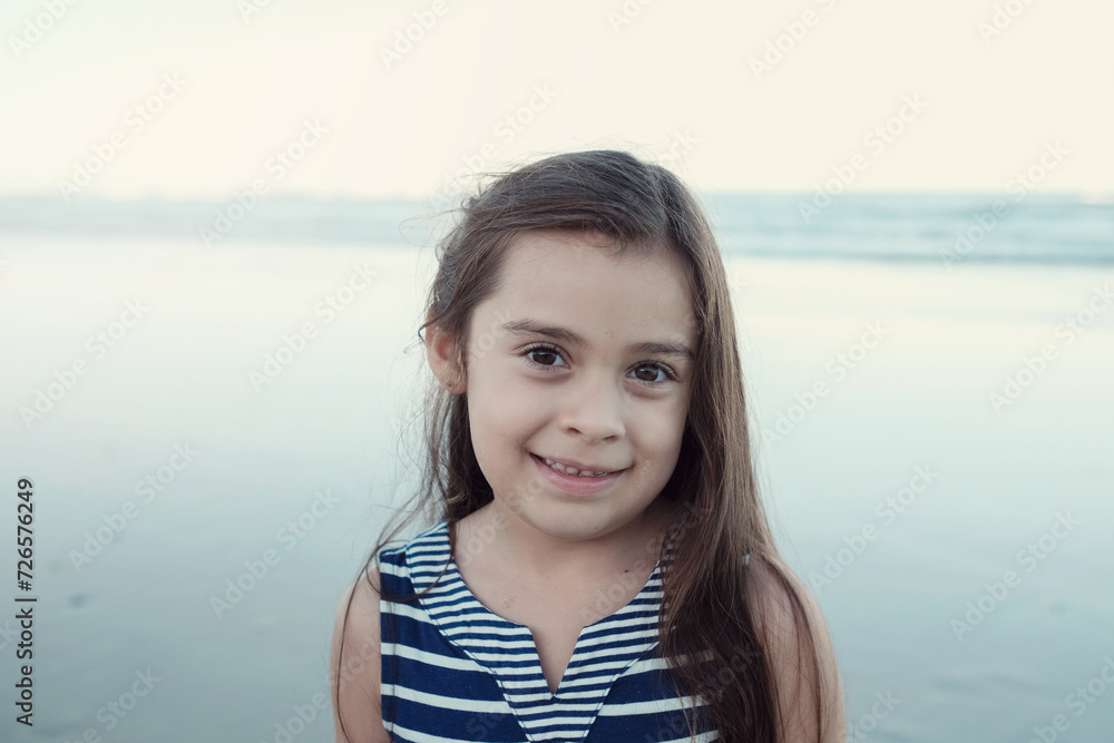 Happy multicultural young little girl on the beach Happy multicultural young little girl on the beach