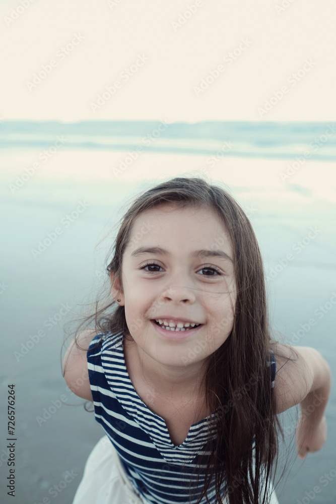 Happy multicultural young little girl on the beach Happy multicultural young little girl on the beach