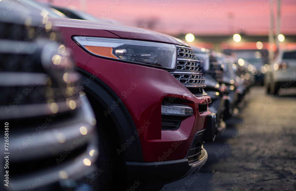 Dealership Parking Lot Full of New Cars During Scenic Sunset Dealership Parking Lot Full of New Cars During Scenic Sunset