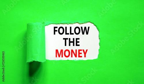 Follow the money symbol. Concept words Follow the money on beautiful white paper. Beautiful green paper background. Business and follow the money concept. Copy space.