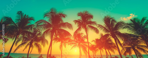 Silhouetted palm trees against a vibrant tropical sunset. Wide banner with copy space.