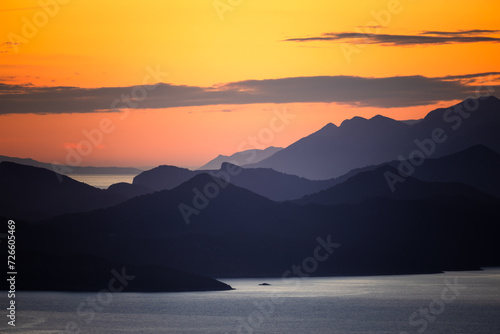 Fototapeta Naklejka Na Ścianę i Meble -  Silhouettes of Elaphiti Islands at sunset, dubravka viewpoint, dubrovnik, croatia, 2023, horizontal format