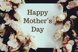 Happy Mothers day text message with flower decoration on black background
