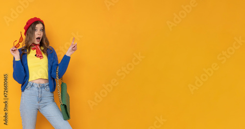 Excited woman in colorful outfit.