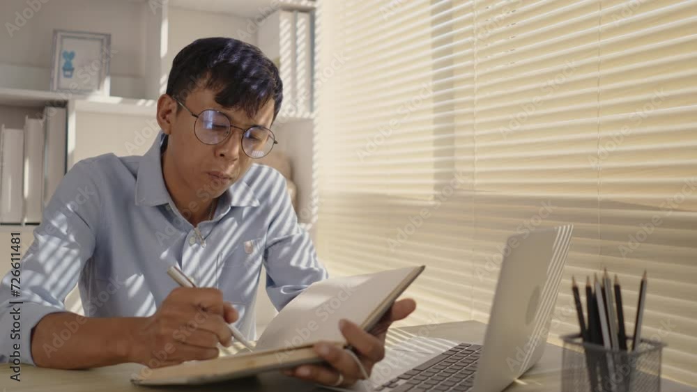 Taking note, Man's Hand Writing an Important Message in Notebook - Communication, Take notes of important messages. Taking note, Man's Hand Writing an Important Message in Notebook - Communication, Take notes of important messages.