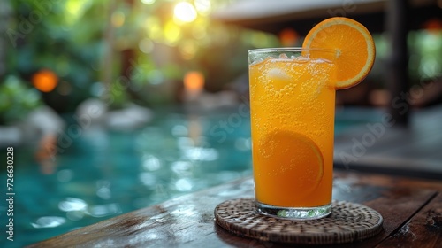 Sunny Day at the Poolside  Fresh Orange Juice by the Swimming Pool  Relaxing with a Glass of Fruit Juice  Cool Drink on a Hot Summer Day.
