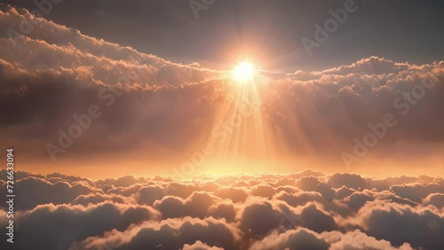 A breathtaking view of the suns glow emerging from behind a cloudy veil. photo