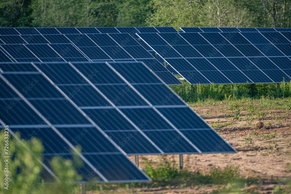 Close up of a solar panel energy farm. Located in Latvia, loads of panels. Green energy. Trying to balance energy consumption. Close up of a solar panel energy farm. Located in Latvia, loads of panels. Green energy. Trying to balance energy consumption.